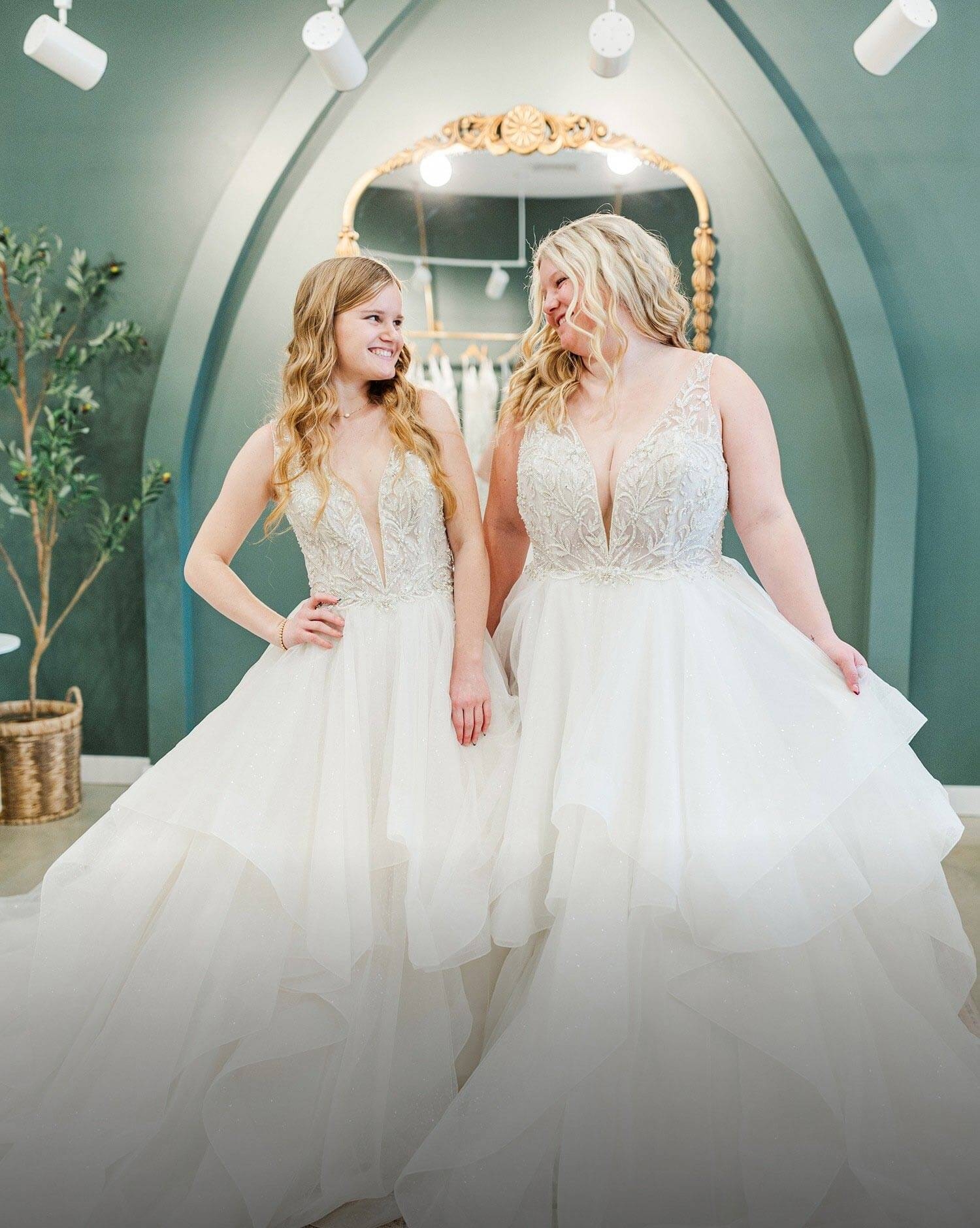 Models wearing a white dresses. Mobile image